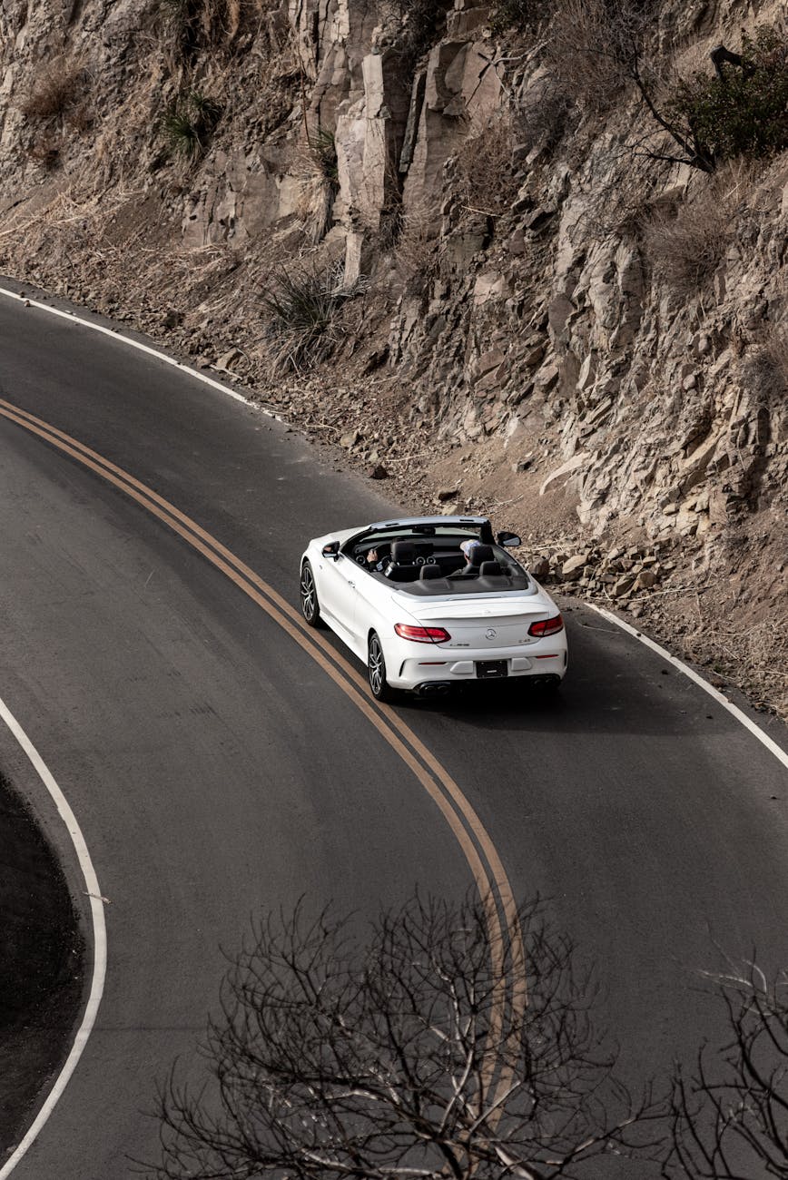white car on road