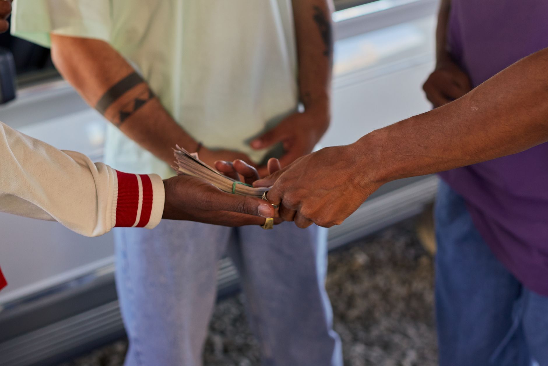person handing over money